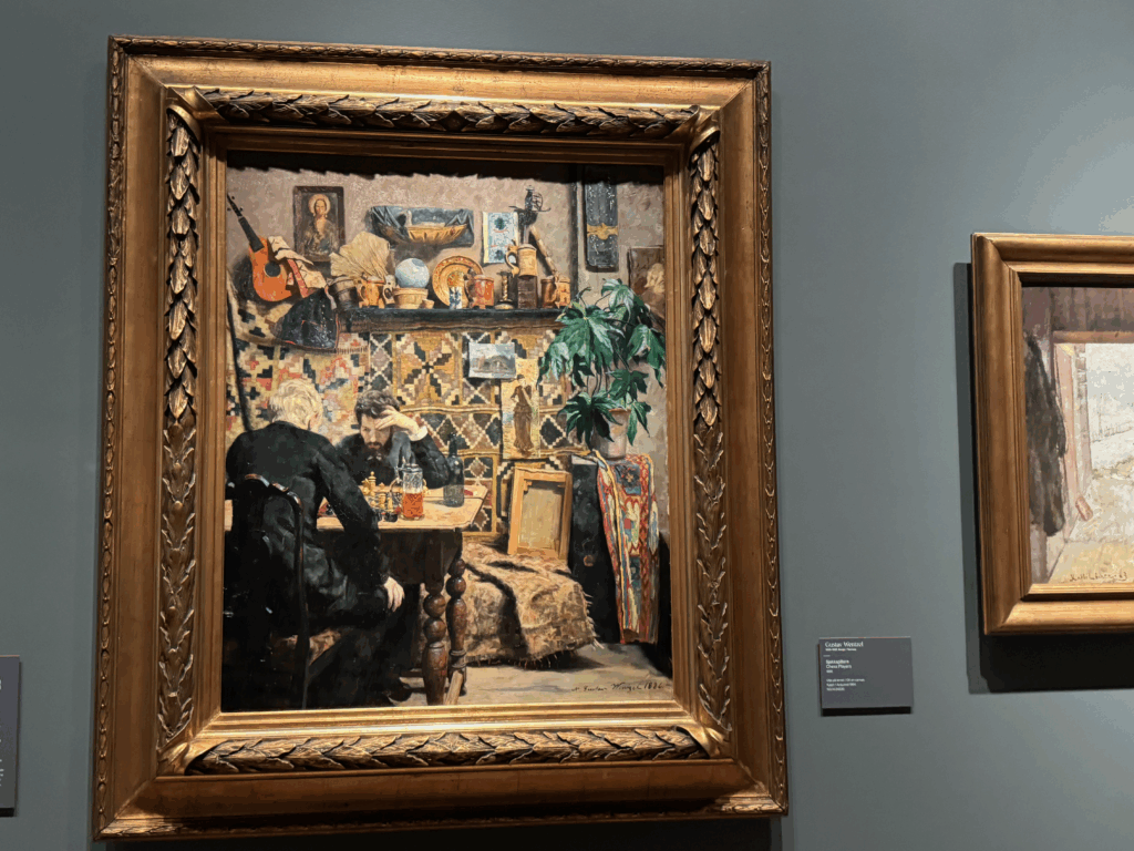ノルウェー国立美術館に展示されているエイリフ・ペーテルセン作《チェスをする人々》。二人の男性がテーブルで真剣にチェスを指している様子を描いた油彩画。